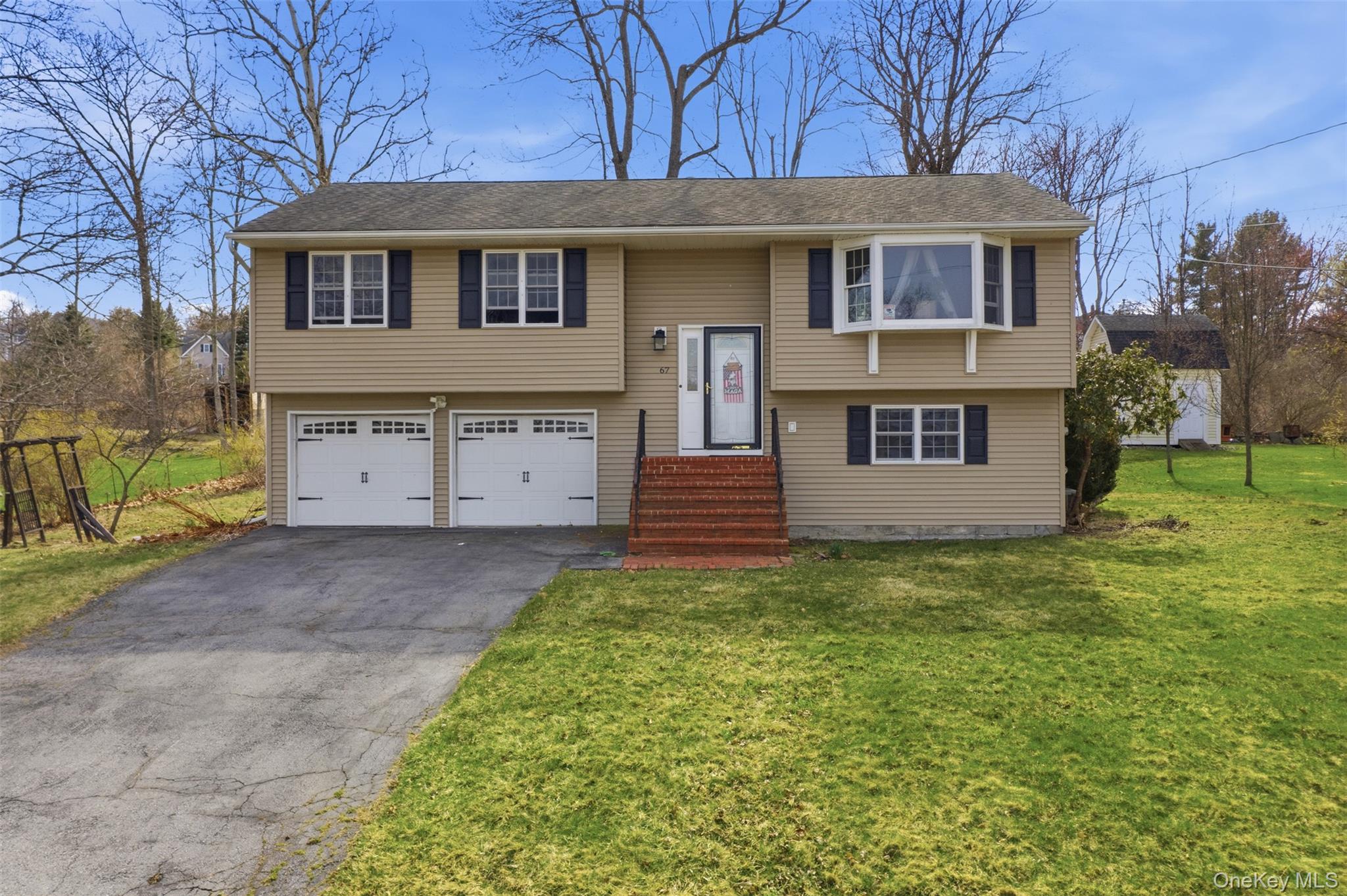 67 High Ridge Road Monroe, NY 10950 - Photo 2 of 34 a view of a house with a yard