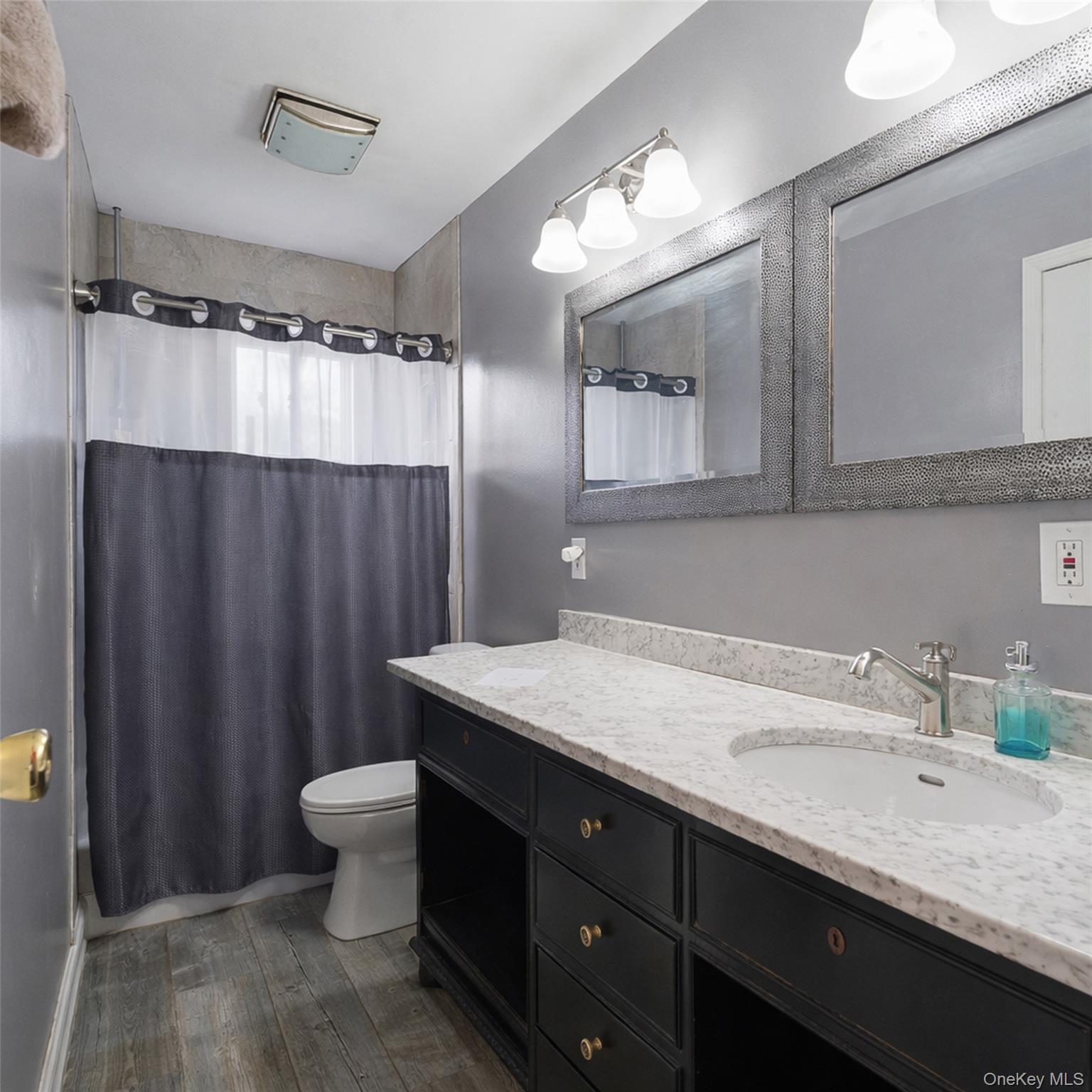 67 High Ridge Road Monroe, NY 10950 - Photo 28 of 34 a bathroom with a granite countertop sink and a mirror