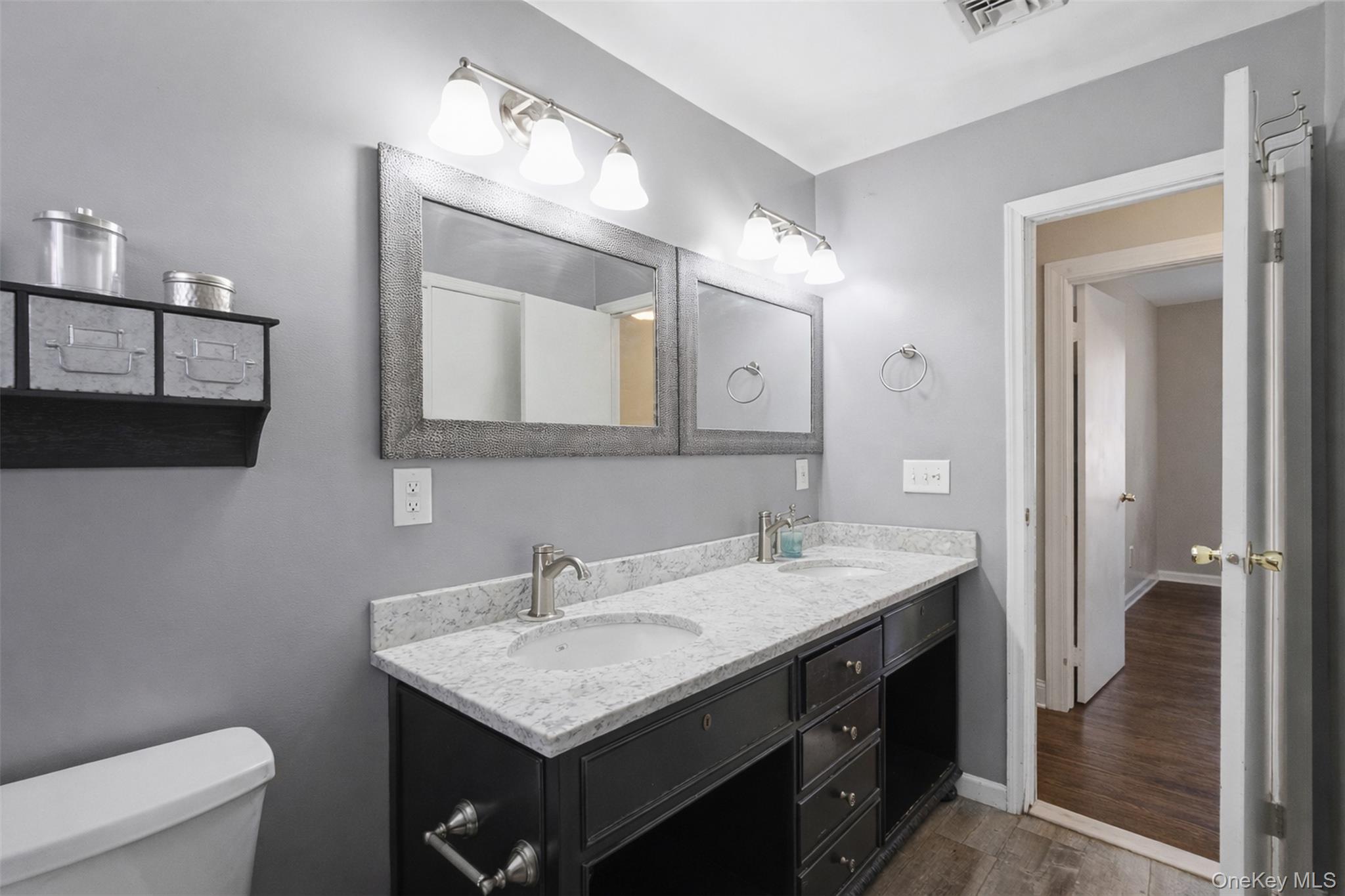67 High Ridge Road Monroe, NY 10950 - Photo 29 of 34 a bathroom with a sink a toilet and a mirror