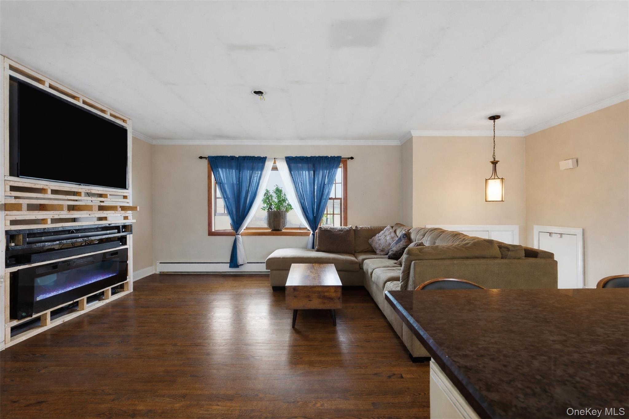 67 High Ridge Road Monroe, NY 10950 - Photo 5 of 34 a living room with furniture and a flat screen tv