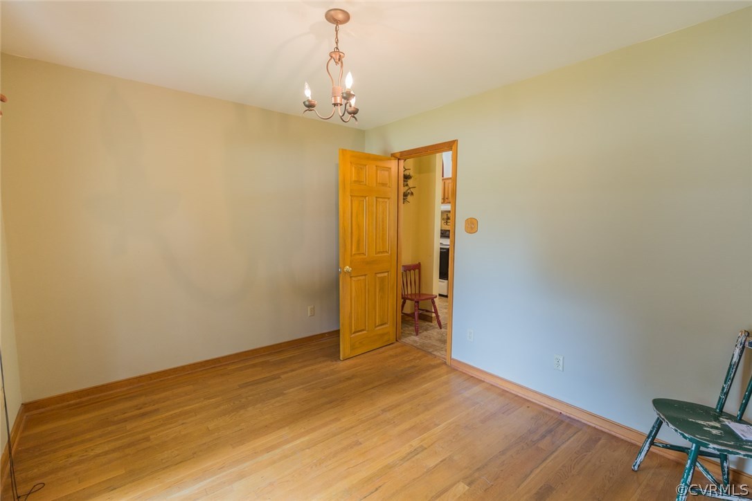6202 Husting Road Chesterfield, VA 23832 - Photo 12 of 50 a view of a room with wooden floor and bedroom