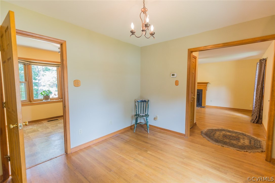 6202 Husting Road Chesterfield, VA 23832 - Photo 13 of 50 a view of a livingroom with wooden floor and a bathroom