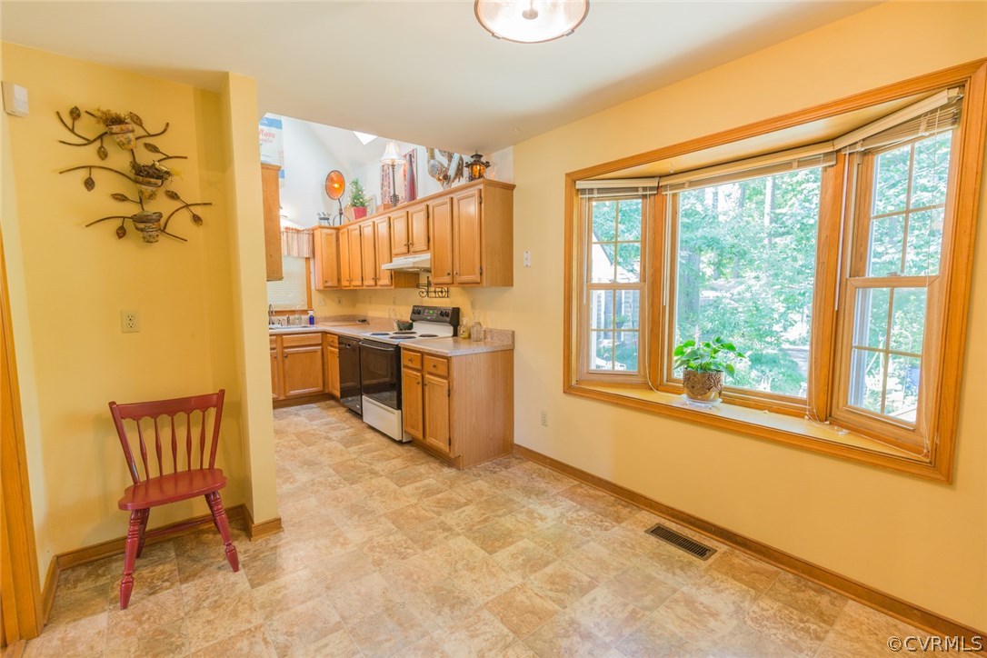 6202 Husting Road Chesterfield, VA 23832 - Photo 16 of 50 a kitchen with stainless steel appliances granite countertop a stove a sink and a refrigerator