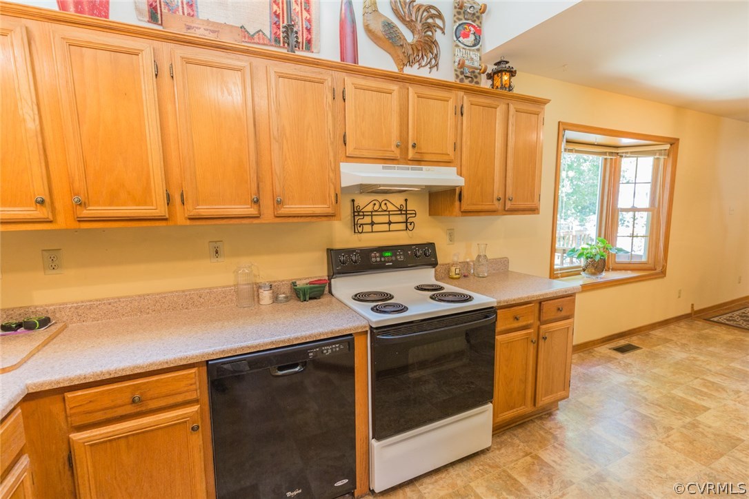 6202 Husting Road Chesterfield, VA 23832 - Photo 19 of 50 a kitchen with stainless steel appliances a stove a sink and cabinets