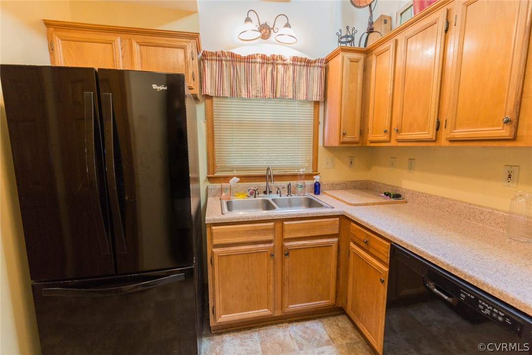6202 Husting Road Chesterfield, VA 23832 - Photo 21 of 50 a kitchen with a sink a refrigerator and cabinets