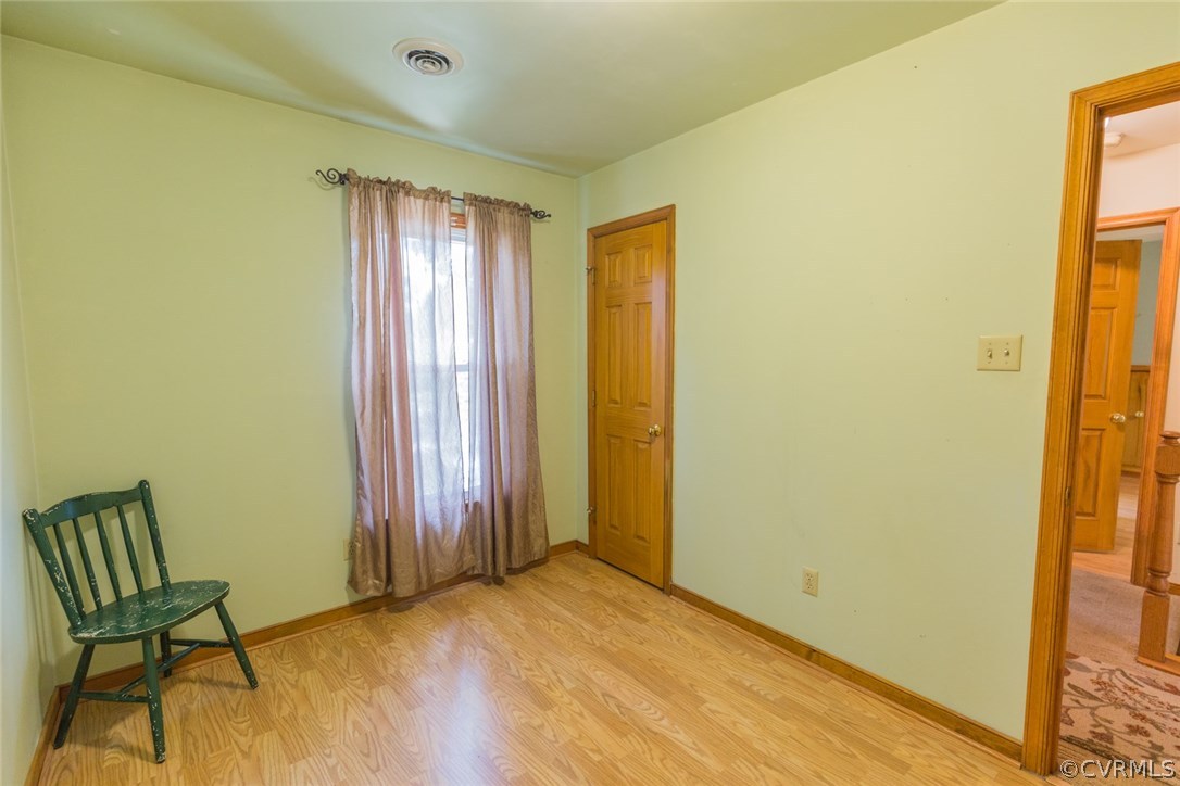6202 Husting Road Chesterfield, VA 23832 - Photo 26 of 50 a view of a room with a wooden floor and a chair