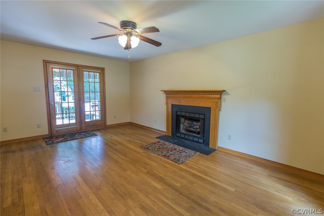 6202 Husting Road Chesterfield, VA 23832 - Photo 7 of 50 a view of empty room with wooden floor and fan