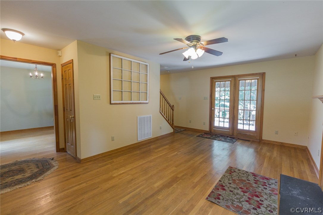 6202 Husting Road Chesterfield, VA 23832 - Photo 8 of 50 a view of an empty room with window and wooden floor