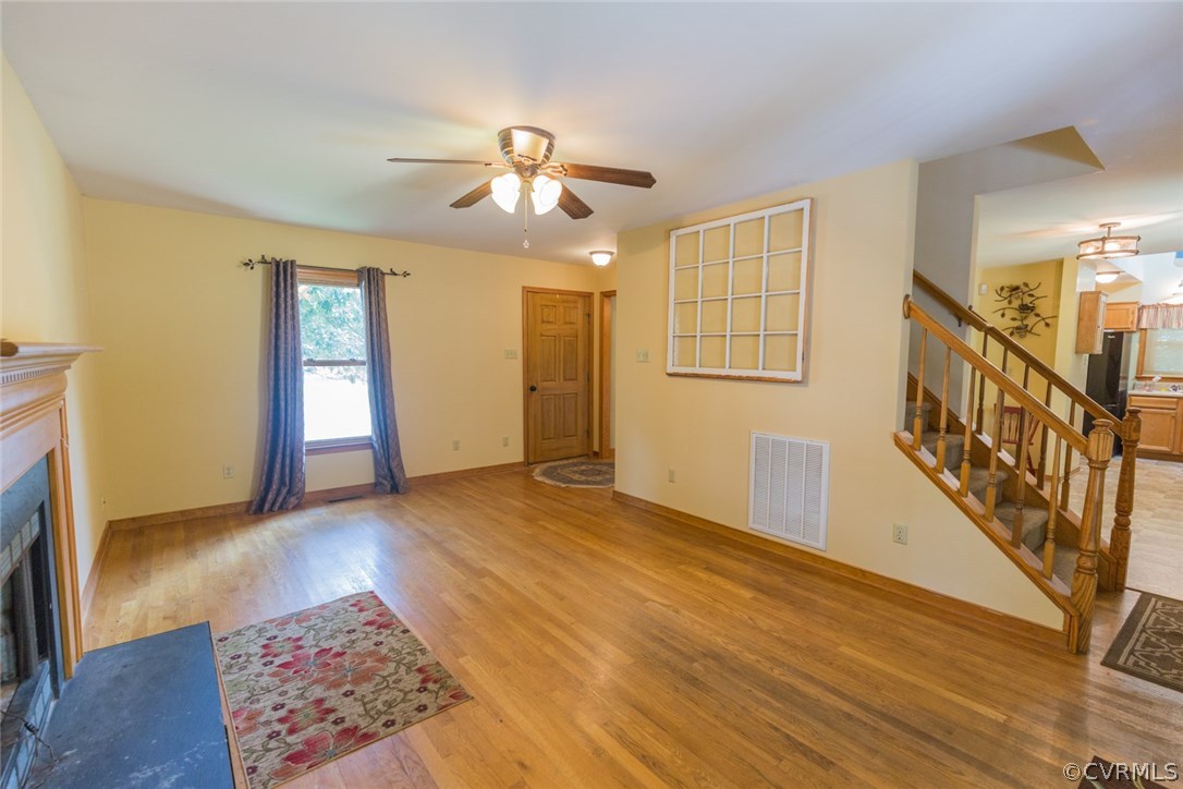 6202 Husting Road Chesterfield, VA 23832 - Photo 9 of 50 a view of an empty room with window and wooden floor