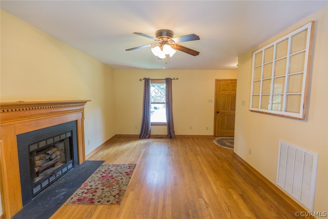 6202 Husting Road Chesterfield, VA 23832 - Photo 10 of 50 a view of an empty room with a fireplace and a window