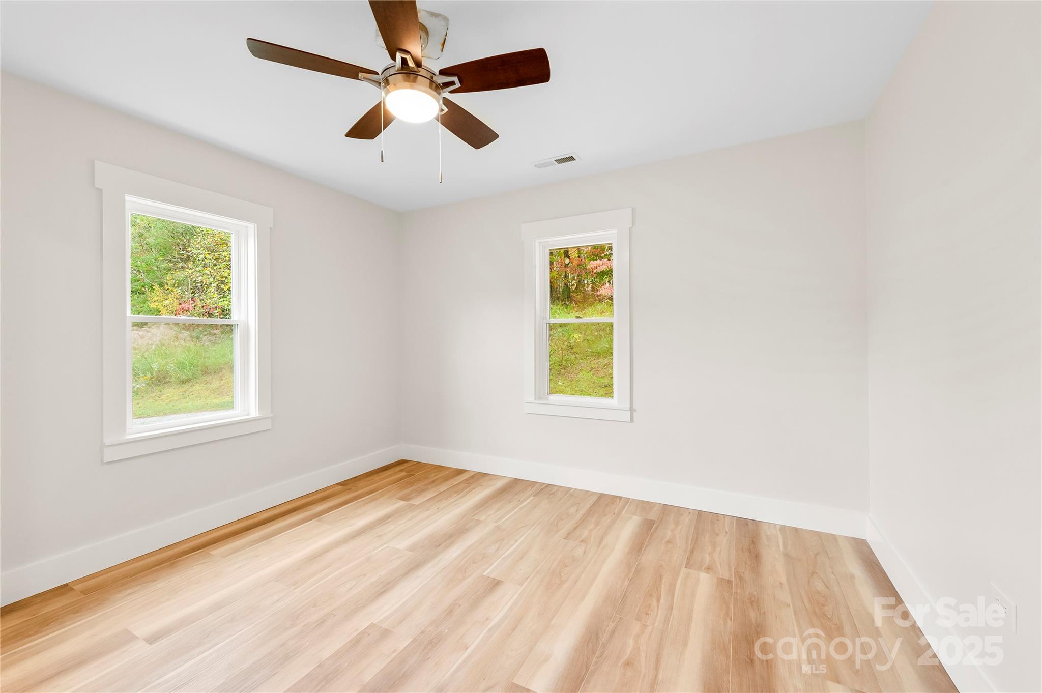 421 Hazel Brook Road Marshall, NC 28753 - Photo 15 of 30 wooden floor in an empty room with a window