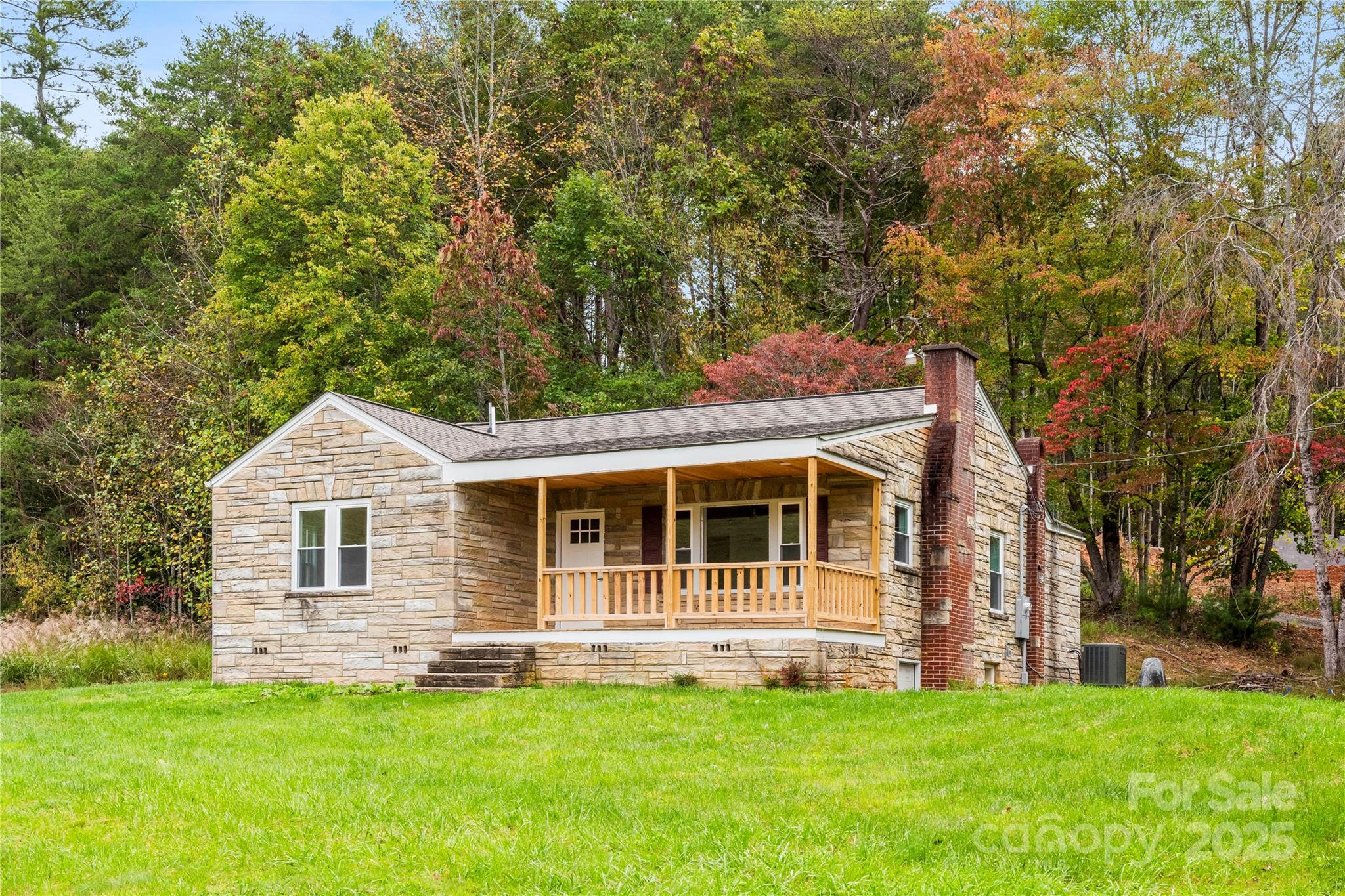 421 Hazel Brook Road Marshall, NC 28753 - Photo 3 of 30 a front view of a house with a garden