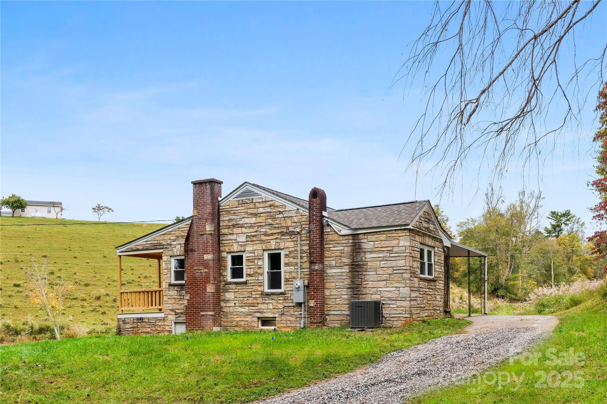 421 Hazel Brook Road Marshall, NC 28753 - Photo 4 of 30 front view of house with a yard