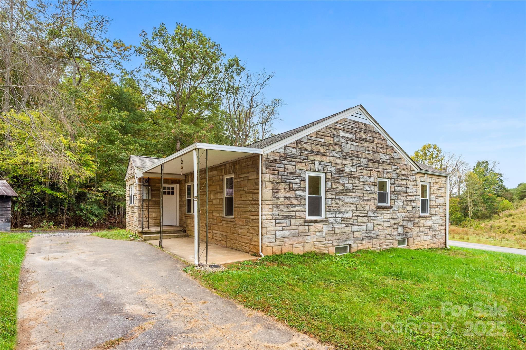 421 Hazel Brook Road Marshall, NC 28753 - Photo 5 of 30 front view of a house with a yard