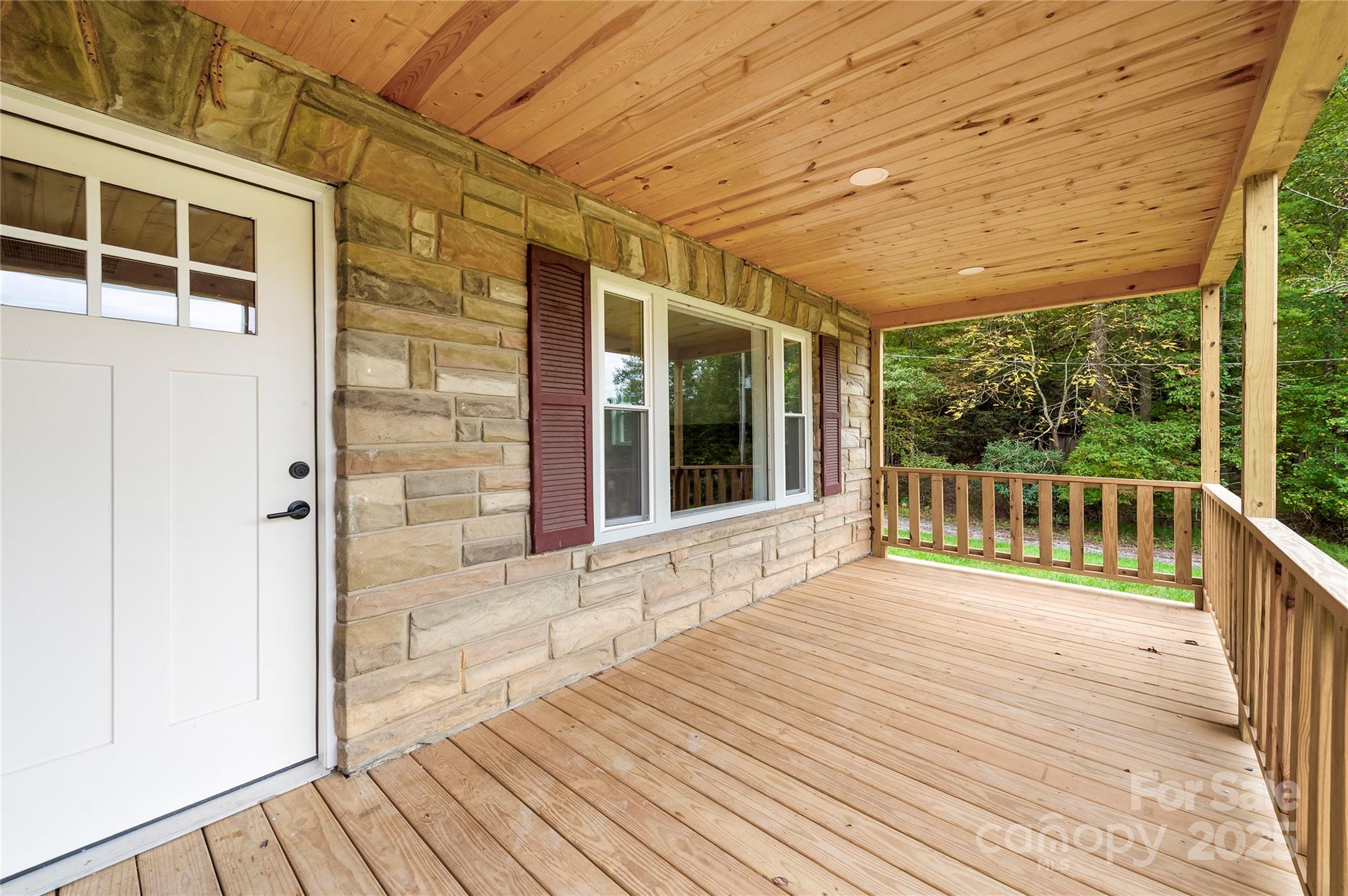 421 Hazel Brook Road Marshall, NC 28753 - Photo 6 of 30 a view of a balcony with wooden floor