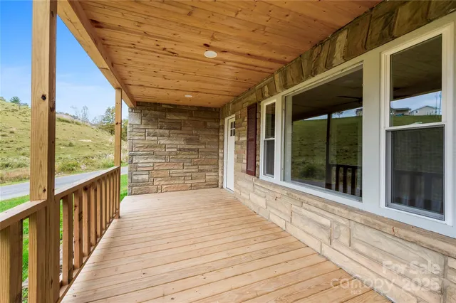 a view of a balcony with wooden floor and floor