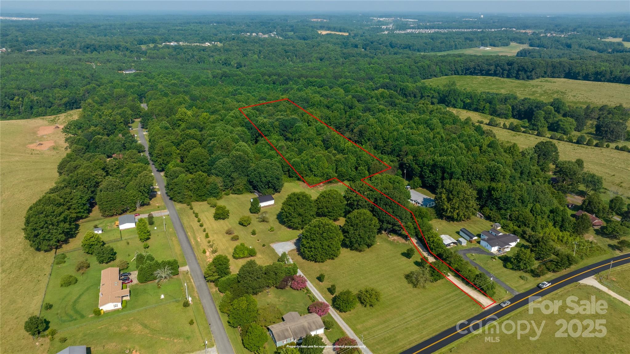 567 Shinnville Road Mooresville, NC 28115 - Photo 2 of 12 an aerial view of residential houses with outdoor space