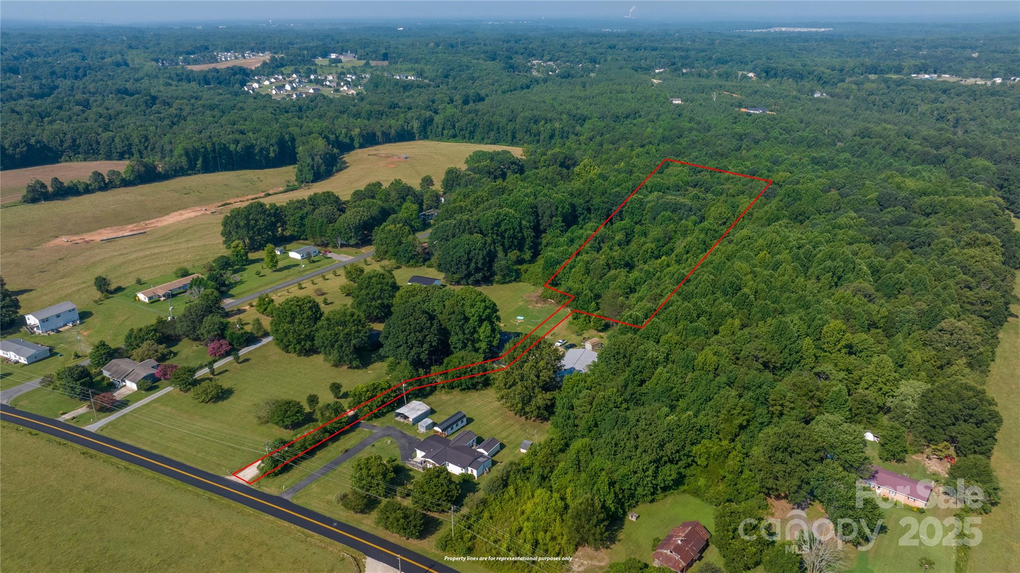 567 Shinnville Road Mooresville, NC 28115 - Photo 3 of 12 a view of a garden with an outdoor seating