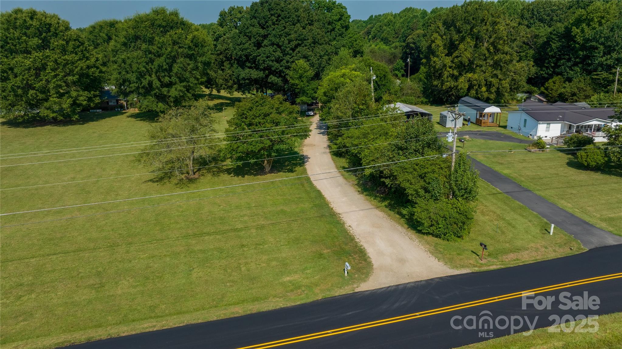 567 Shinnville Road Mooresville, NC 28115 - Photo 5 of 12 a view of a yard with chairs