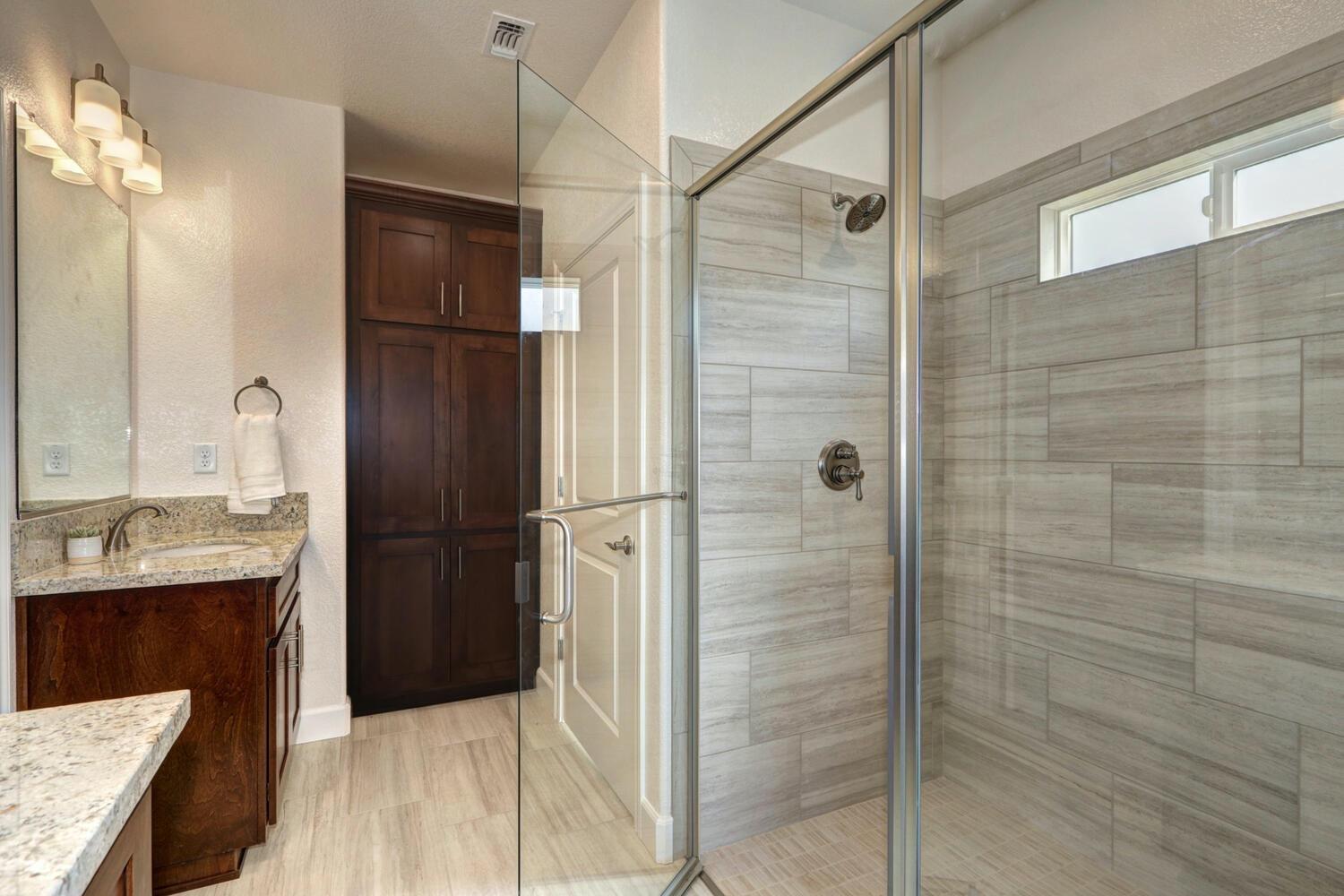 932 Norman Road Galt, CA 95632 - Photo 18 of 21 a bathroom with a shower and a sink