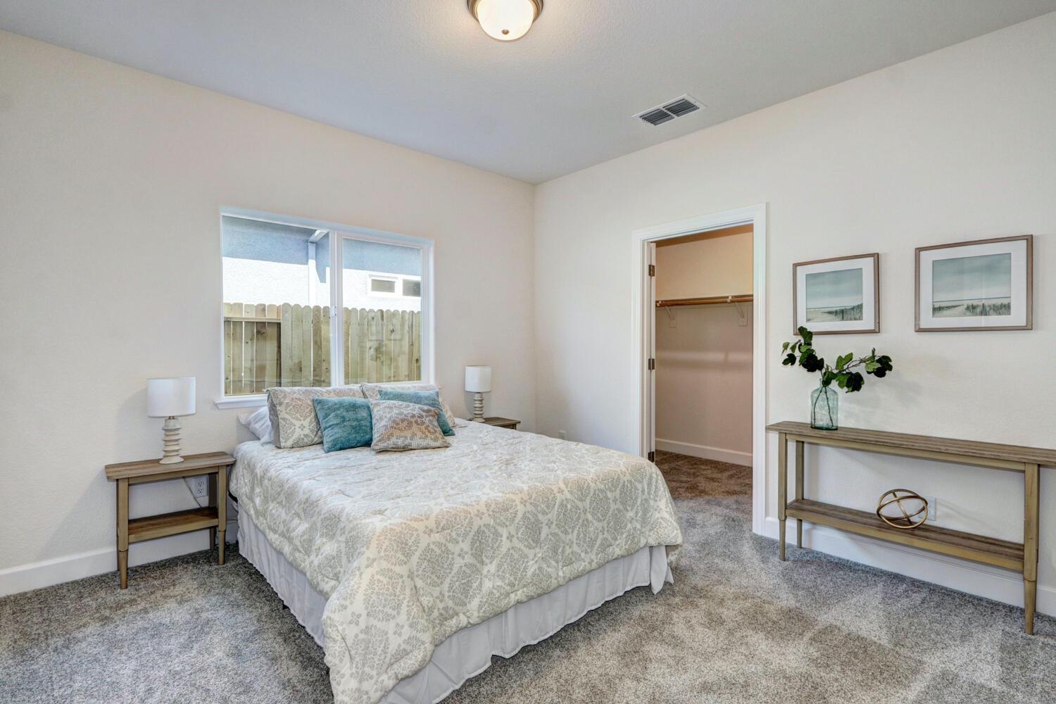 932 Norman Road Galt, CA 95632 - Photo 19 of 21 a bedroom with a bed and a table