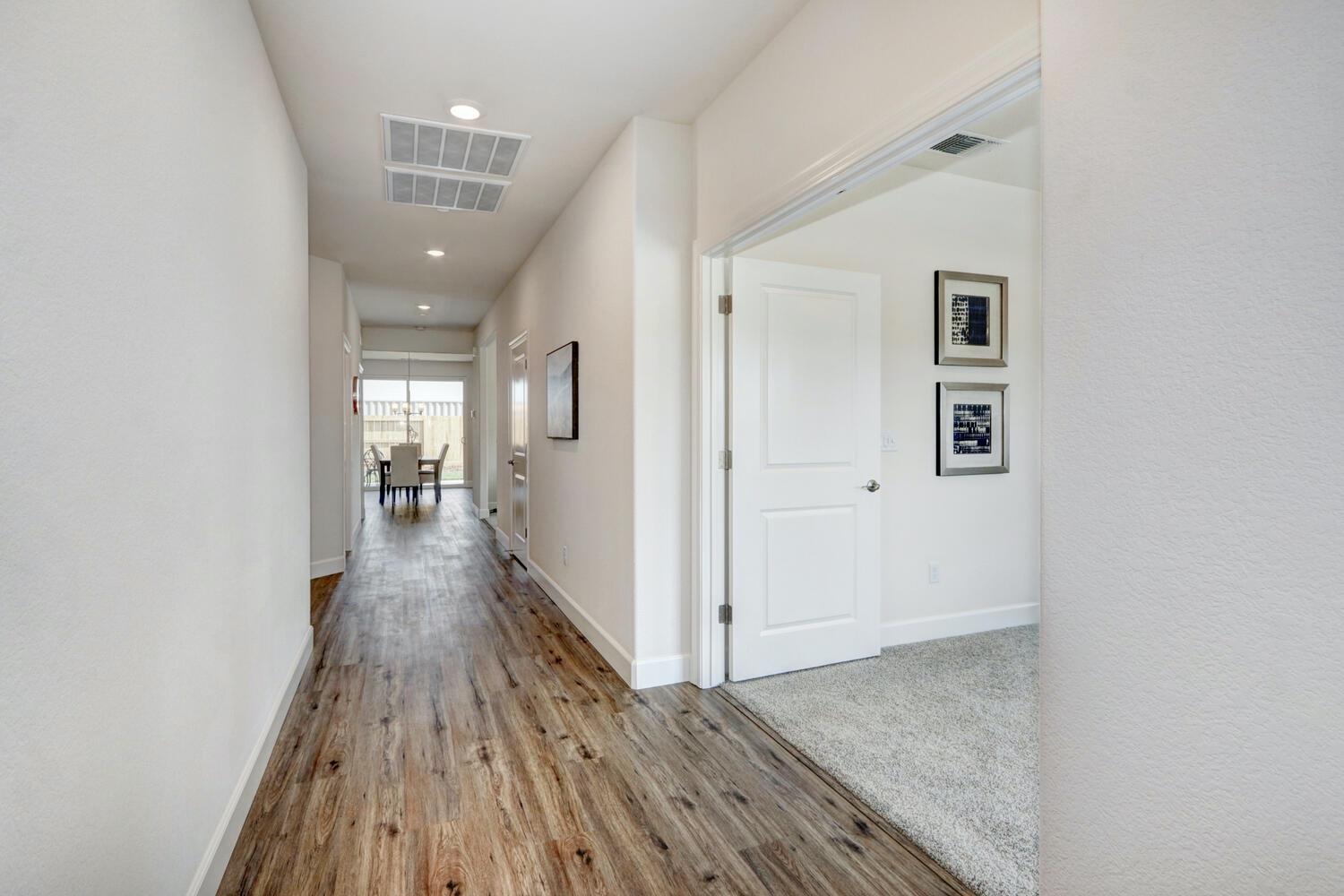 932 Norman Road Galt, CA 95632 - Photo 2 of 21 wooden floor in a hall with a window