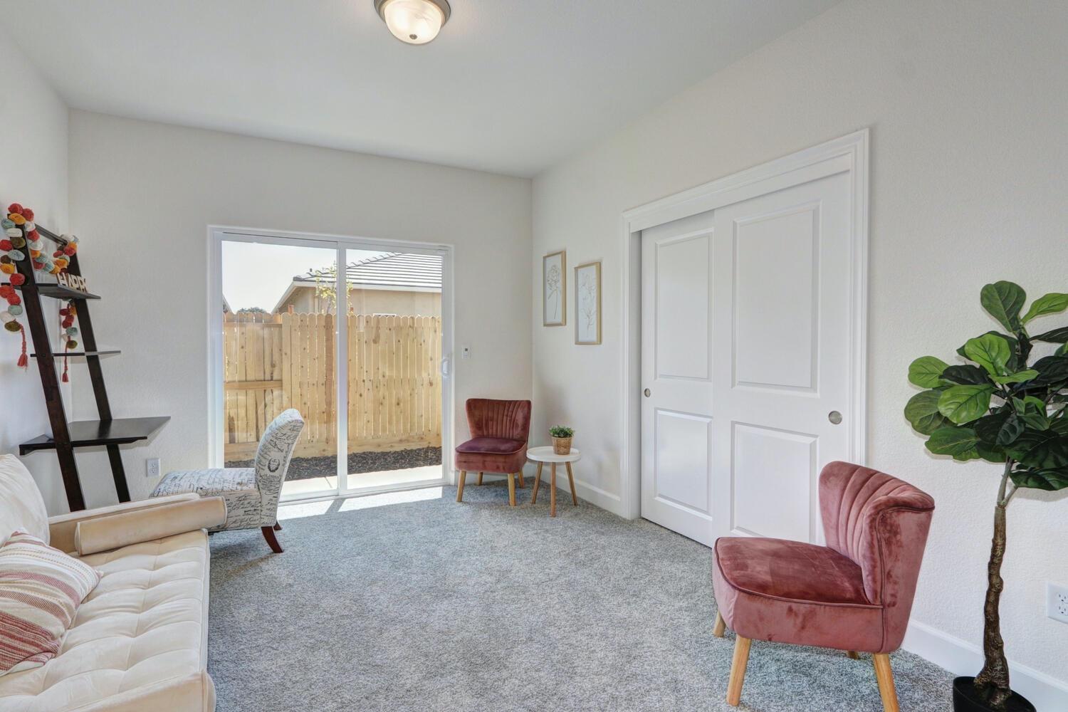 932 Norman Road Galt, CA 95632 - Photo 6 of 21 a living room with furniture and a potted plant