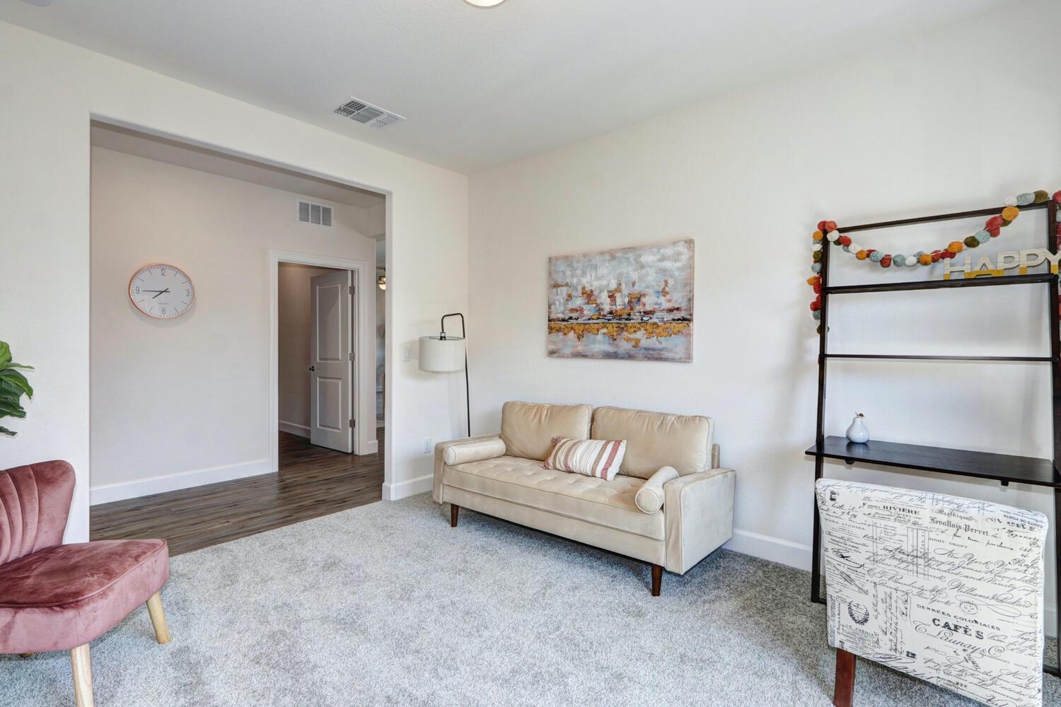 932 Norman Road Galt, CA 95632 - Photo 7 of 21 a living room with furniture and a flat screen tv