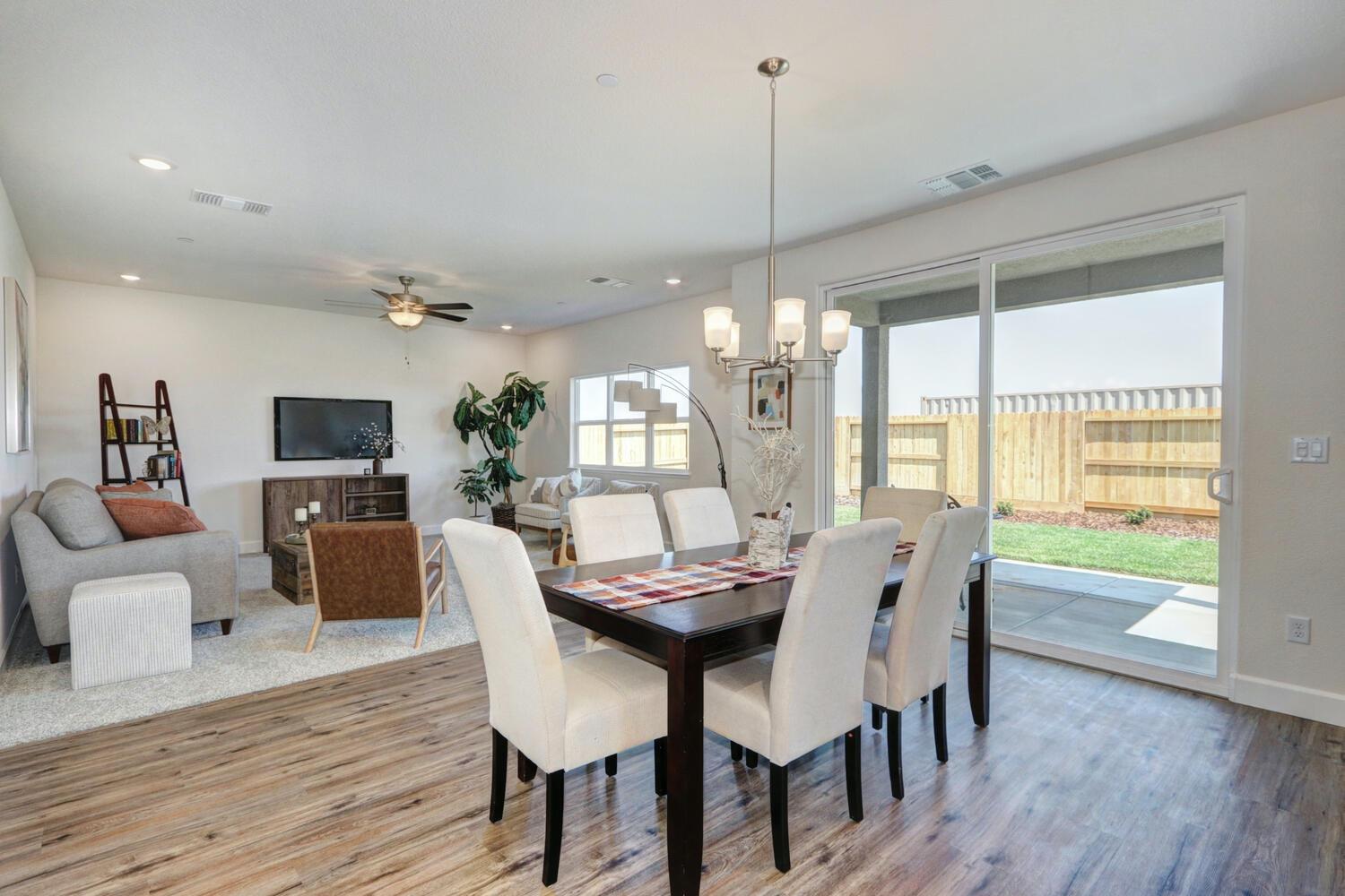 932 Norman Road Galt, CA 95632 - Photo 8 of 21 a view of a dining room with furniture window and wooden floor