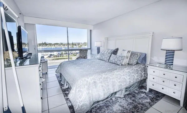 a bedroom with a bed and a dresser