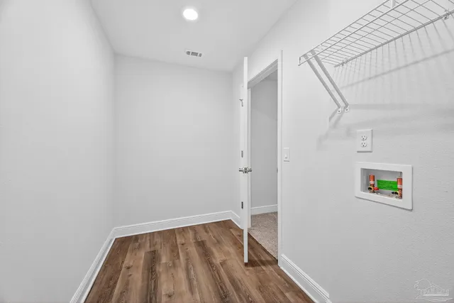 a bathroom with a granite countertop sink a mirror and a shower