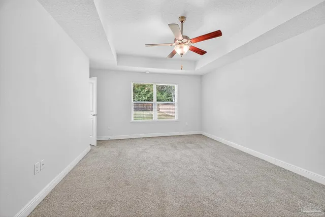 a kitchen with granite countertop stainless steel appliances and wooden cabinets