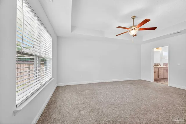 a kitchen with a sink cabinets and window