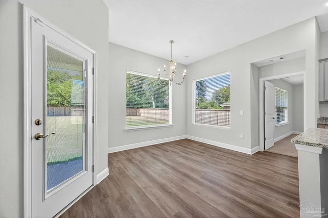 a kitchen with a refrigerator stove and cabinets