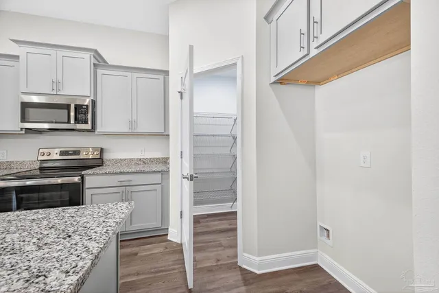 a view of an empty room and a window