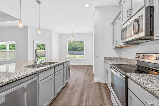a view of an empty room and a window