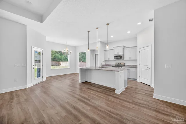 a bathroom with a toilet sink a shower and a mirror