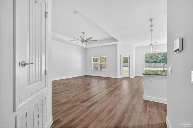 a bathroom with a granite countertop sink toilet mirror and shower