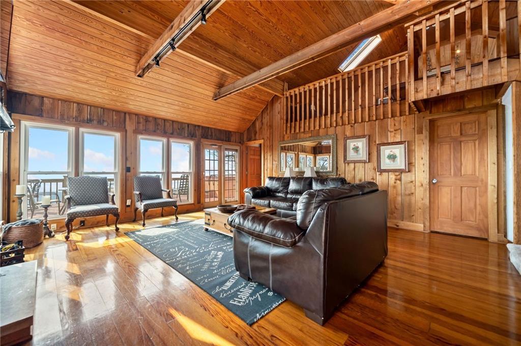 1474 Deer Run Ridge Jasper, GA 30143 - Photo 14 of 50 a living room with furniture a large window and wooden floor