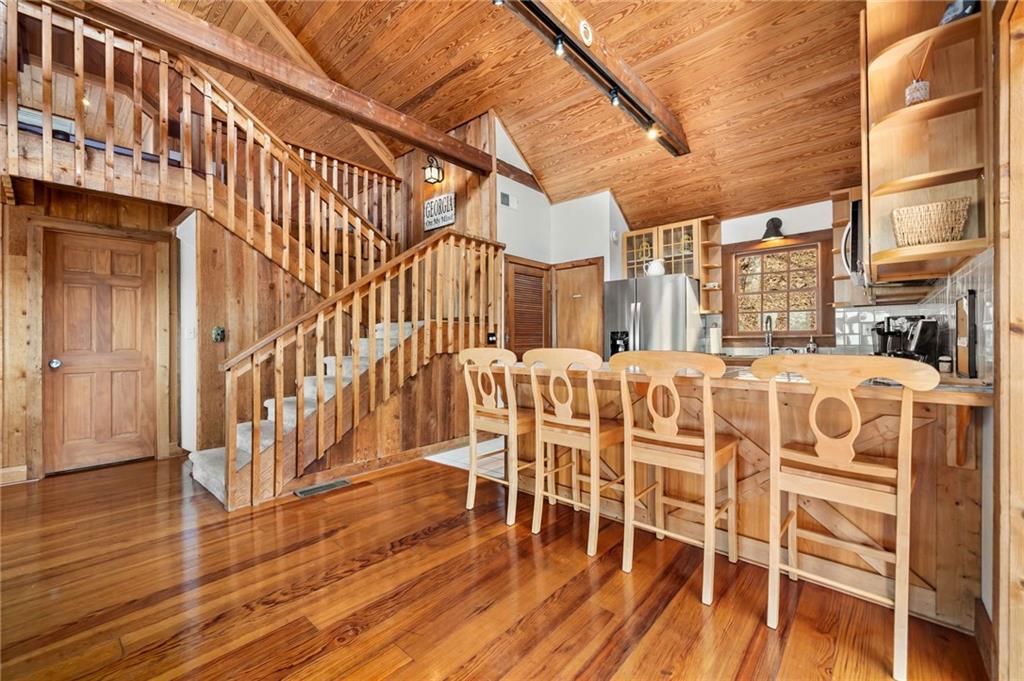 1474 Deer Run Ridge Jasper, GA 30143 - Photo 17 of 50 a dining room with wooden floor table and chairs