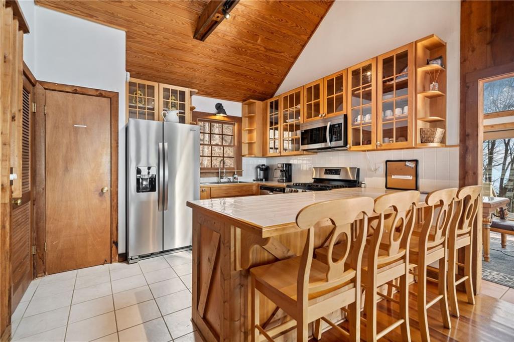 1474 Deer Run Ridge Jasper, GA 30143 - Photo 19 of 50 a front view of a building with a couple of table and chairs