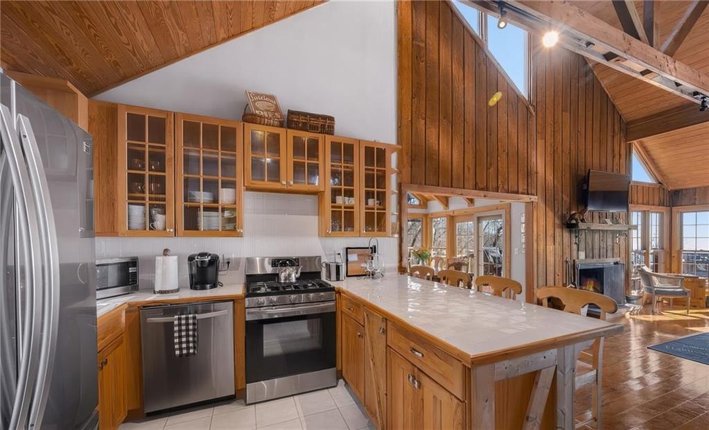 1474 Deer Run Ridge Jasper, GA 30143 - Photo 20 of 50 a kitchen with a stove a sink and a refrigerator