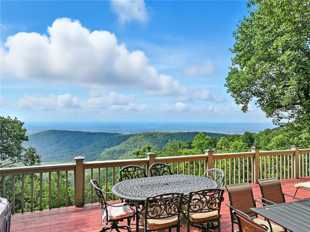 1474 Deer Run Ridge Jasper, GA 30143 - Photo 2 of 50 a view of a chairs and table on the deck