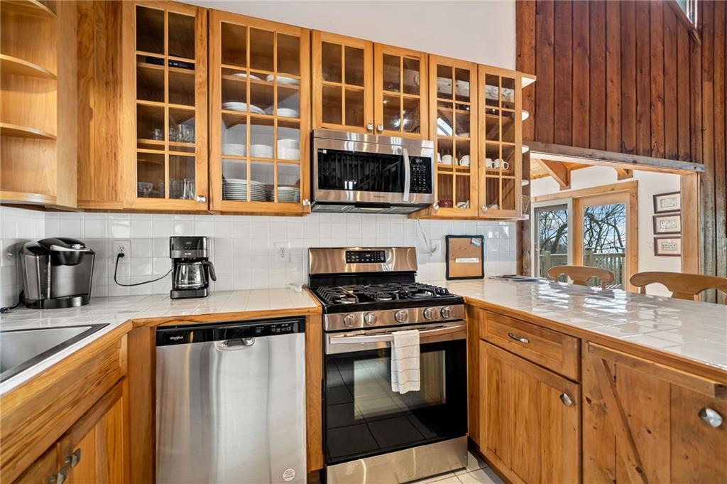 1474 Deer Run Ridge Jasper, GA 30143 - Photo 21 of 50 a kitchen with stainless steel appliances granite countertop a stove and a sink