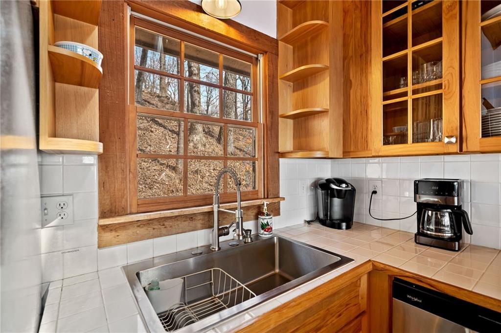 1474 Deer Run Ridge Jasper, GA 30143 - Photo 23 of 50 a kitchen with granite countertop a sink and a stove