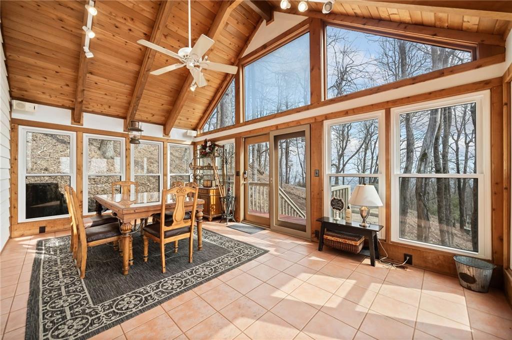 1474 Deer Run Ridge Jasper, GA 30143 - Photo 24 of 50 a dining room with furniture water view and wooden floor
