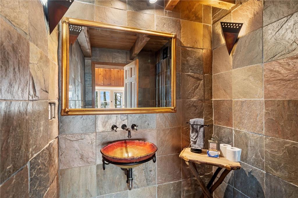 1474 Deer Run Ridge Jasper, GA 30143 - Photo 26 of 50 a bathroom with a sink and a mirror