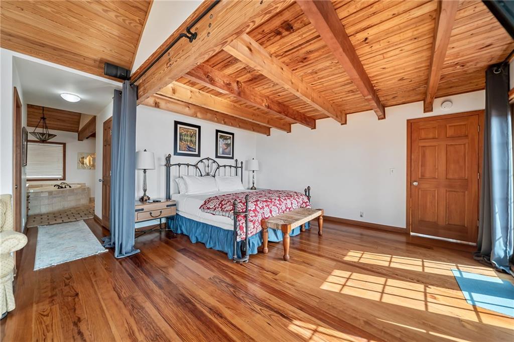 1474 Deer Run Ridge Jasper, GA 30143 - Photo 27 of 50 a bedroom with a bed and wooden floor