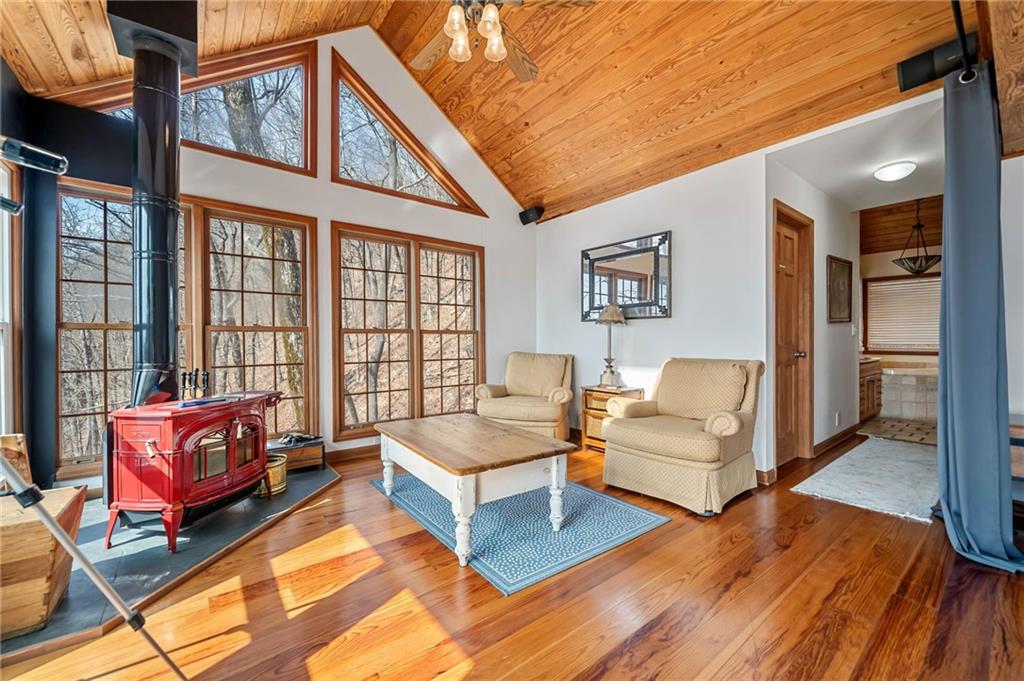 1474 Deer Run Ridge Jasper, GA 30143 - Photo 31 of 50 a living room with furniture fireplace and a large window