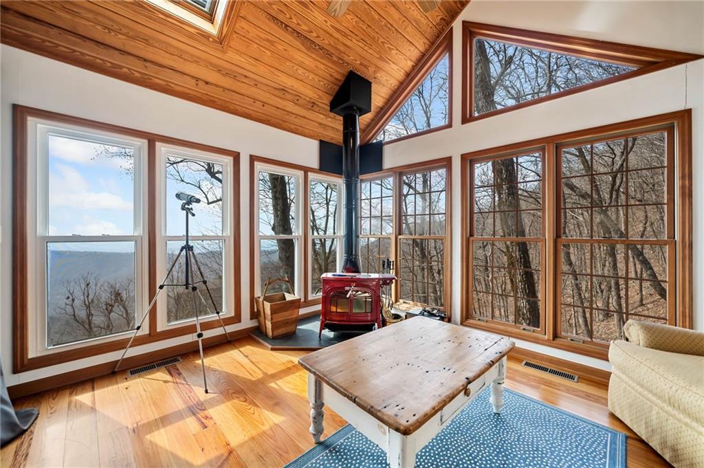 1474 Deer Run Ridge Jasper, GA 30143 - Photo 32 of 50 a living room with furniture and large windows